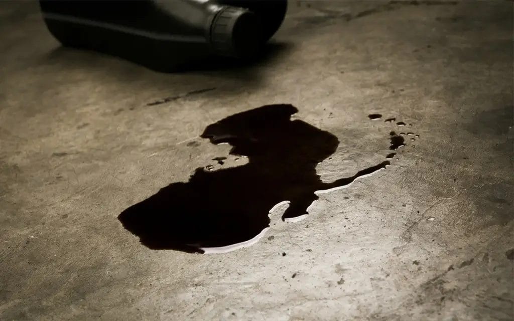 Clean and degrease oil stains on garage floor