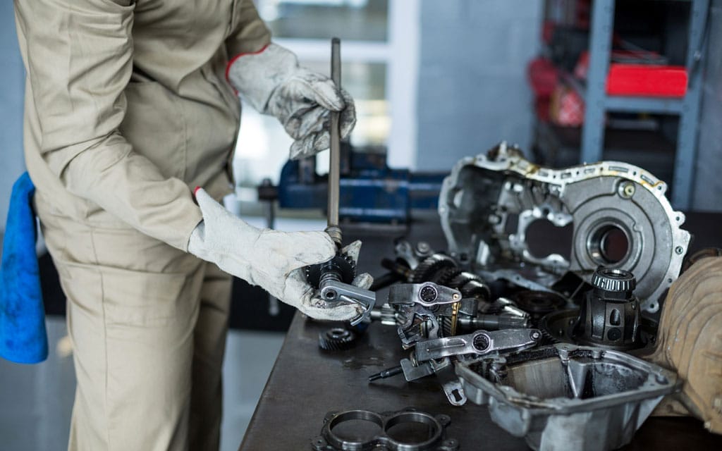 Mechanic degreasing parts with Petro Buster